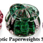 A group of three glass sculptures with the words " geometric paperweights $ 1 0. 9 5 ".