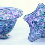 A pair of bowls with purple and blue designs.
