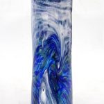 A blue and white vase with swirling design.