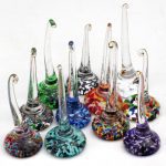 A group of glass pipes sitting on top of each other.